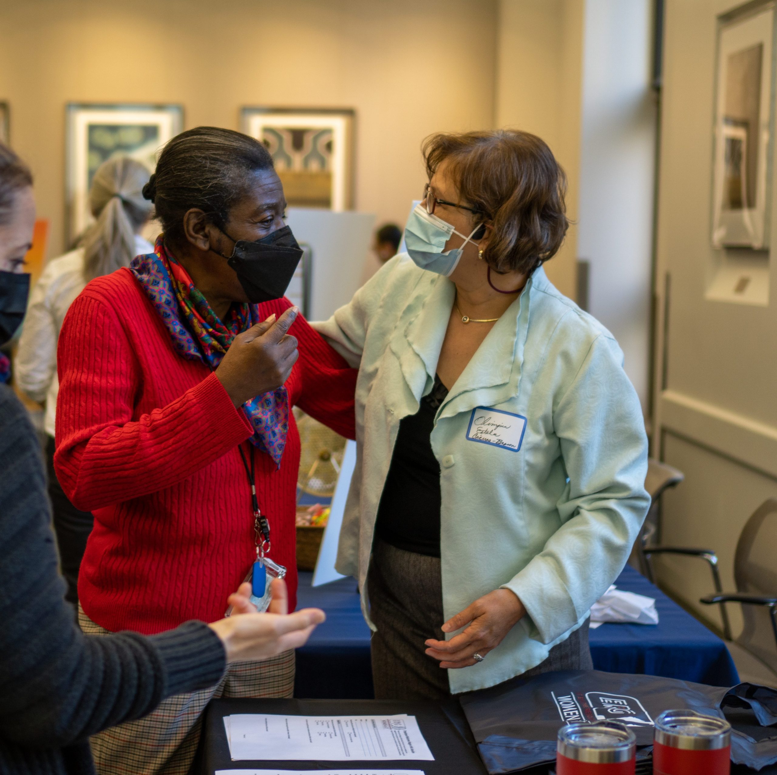 photo of Olimpia and Virginia talking at welcome wagon event